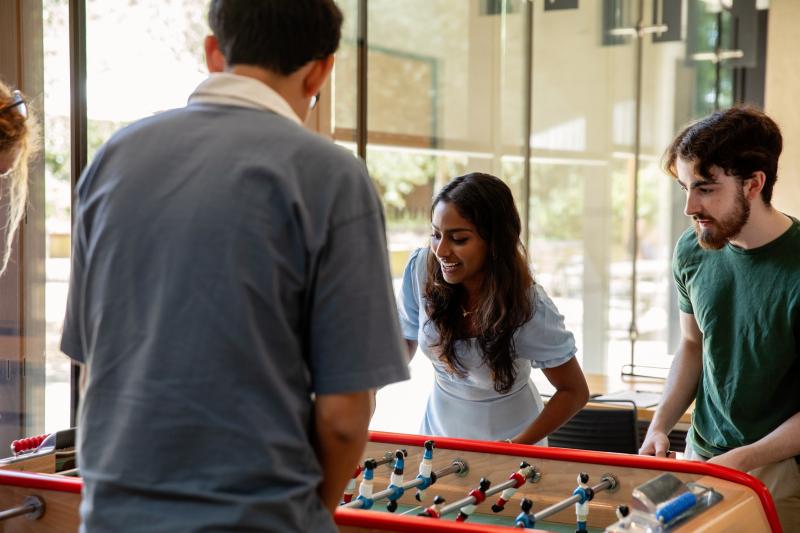 Students having fun playing table football