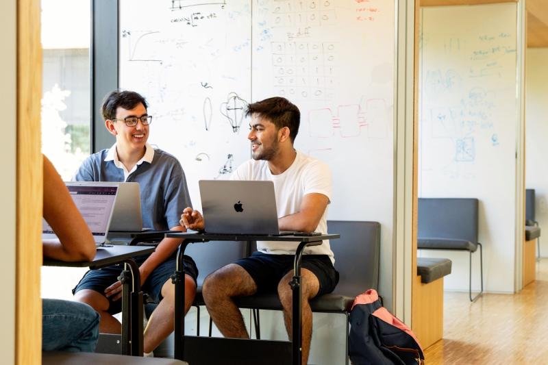 Students studying in a booth